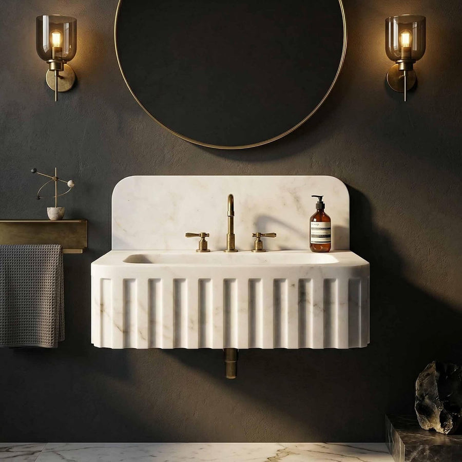 Hand-carved Carrara marble bathroom sink with fluted exterior and rectangular vessel basin