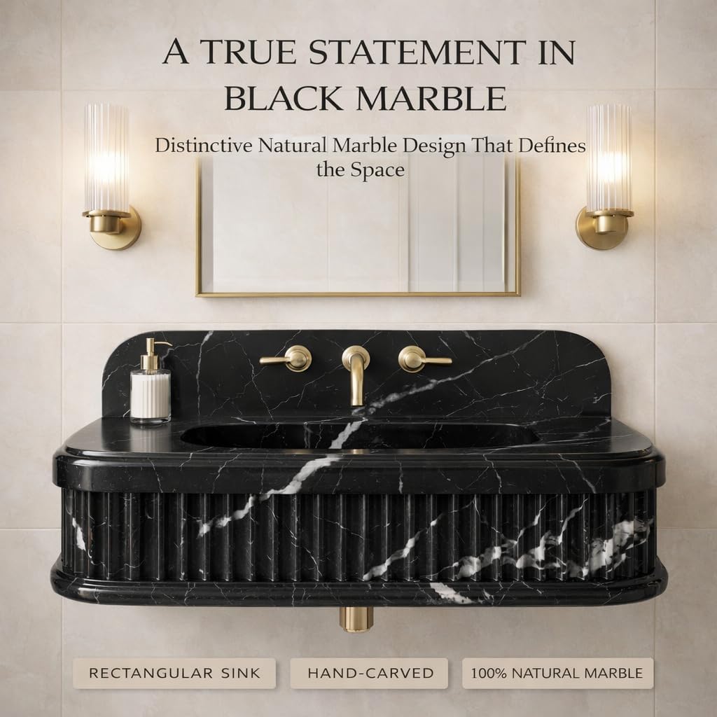 Black marble sink with gold fixtures in a bathroom setting