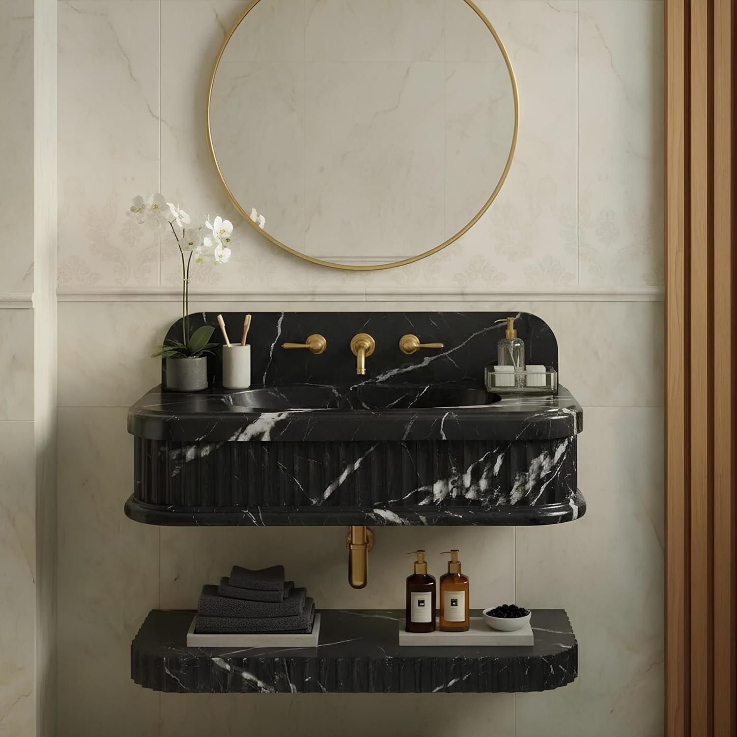 Bathroom vanity with black marble countertop, round mirror, and decorative items.