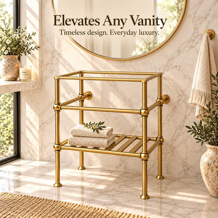 A gold-framed double vanity stand with a top shelf and lower slatted tray, shown in a bright marble bathroom setting with folded towels, plants, and a round mirror. Text at the top reads, 'Elevates Any Vanity.