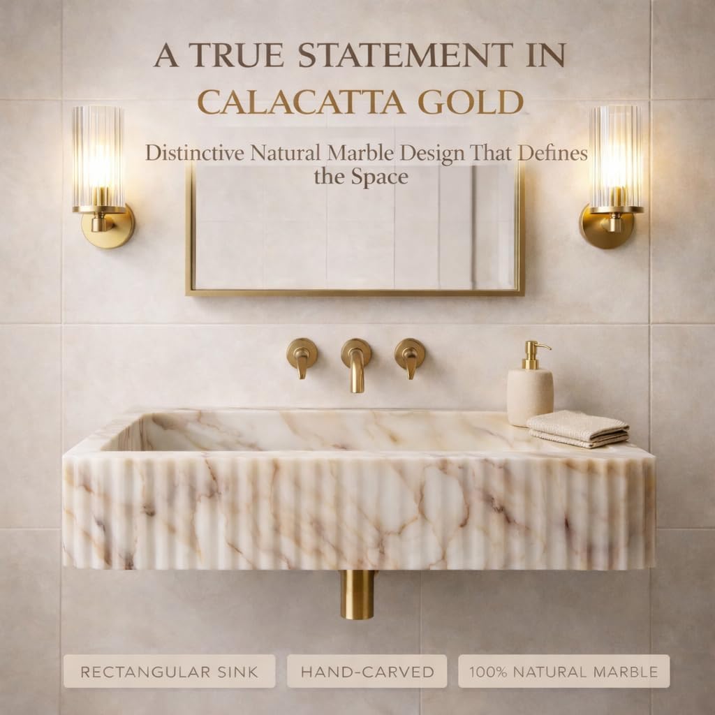 Marble sink with gold fixtures in a bathroom setting, featuring text about Calacatta Gold marble.