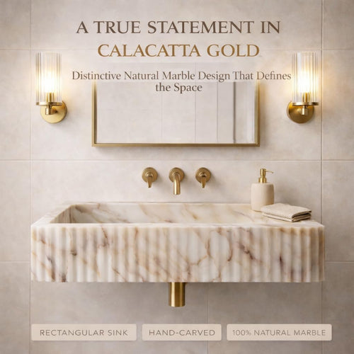 Marble sink with gold fixtures in a bathroom setting, featuring text about Calacatta Gold marble.