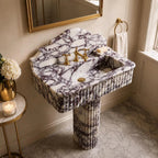Calacatta viola marble sink with pedestal in a bathroom
