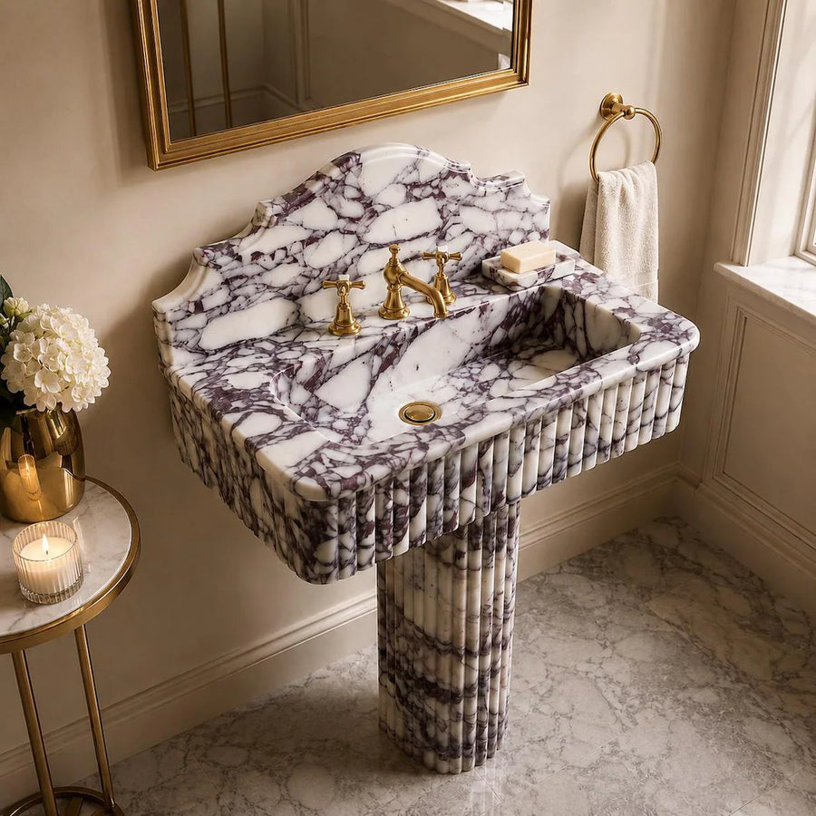 Calacatta viola marble sink with pedestal in a bathroom