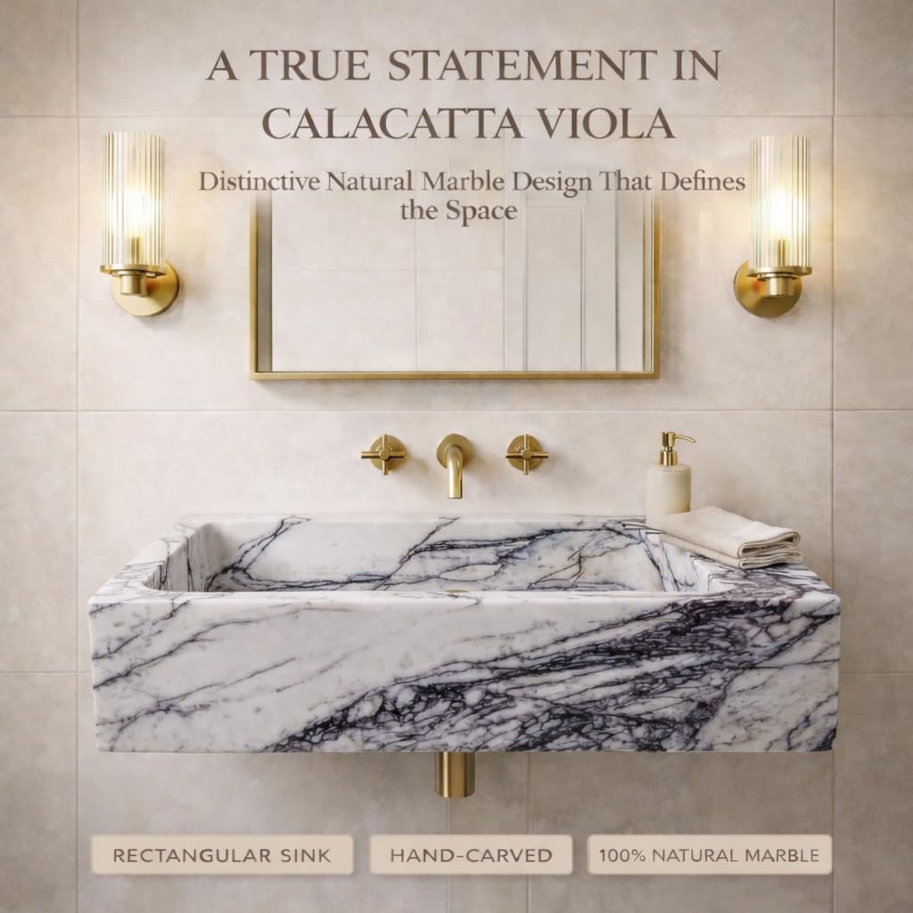 Bathroom with marble sink and gold fixtures, featuring text about Calacatta Viola marble.