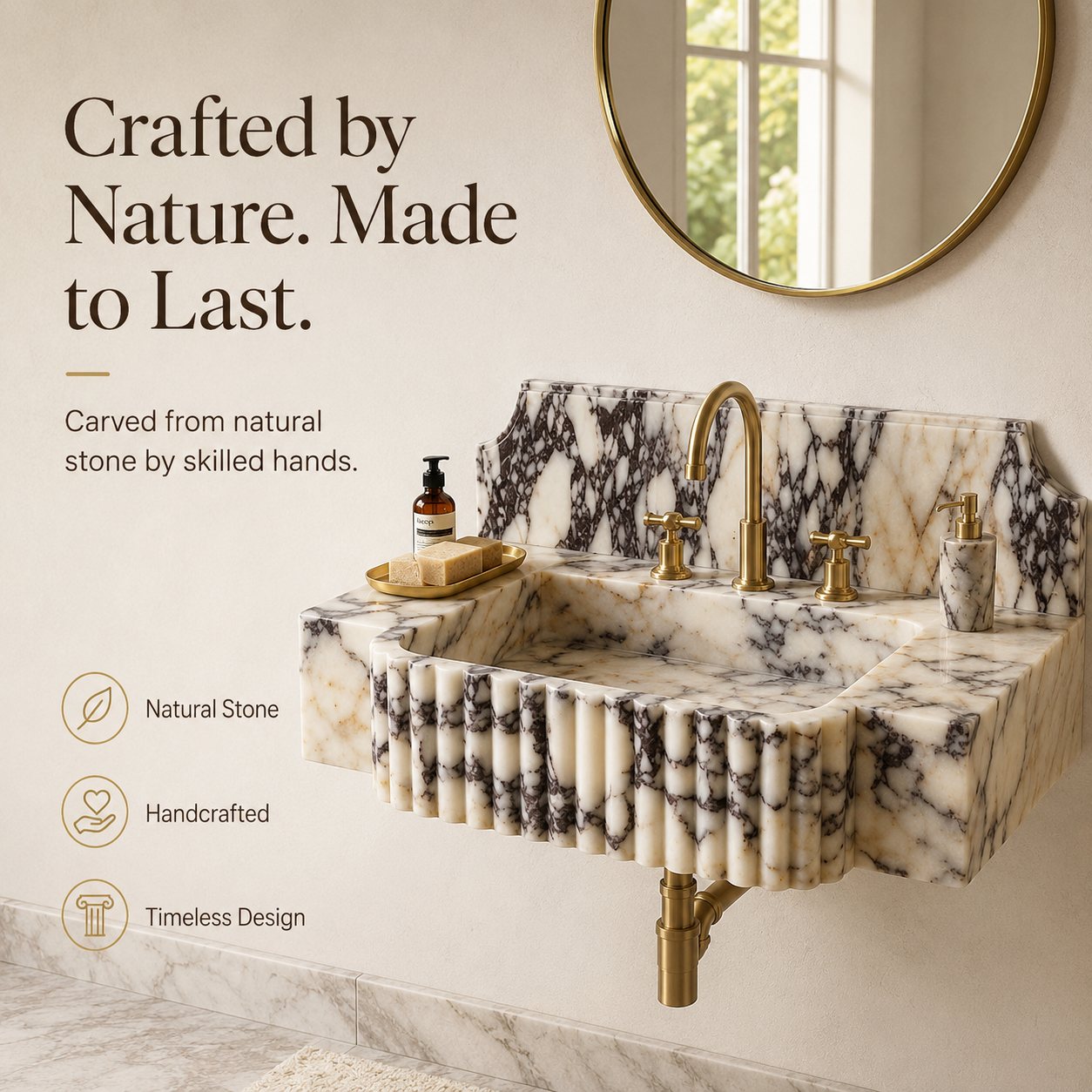A wall-mounted marble sink with a fluted front, gold faucet, and matching gold soap dispenser, shown in a bathroom setting with text callouts and a round mirror on the wall.