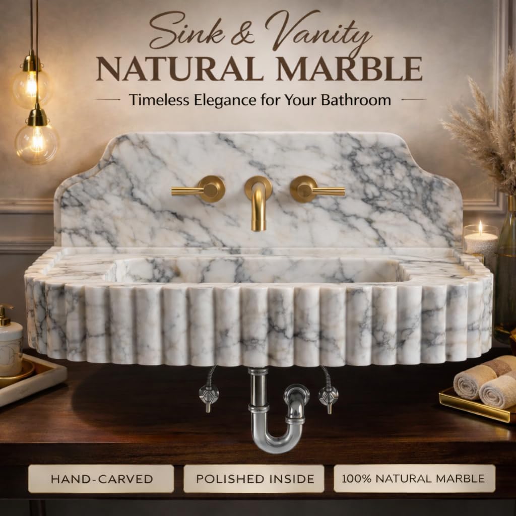 Marble sink with gold faucet on a wooden vanity, featuring text about natural marble.
