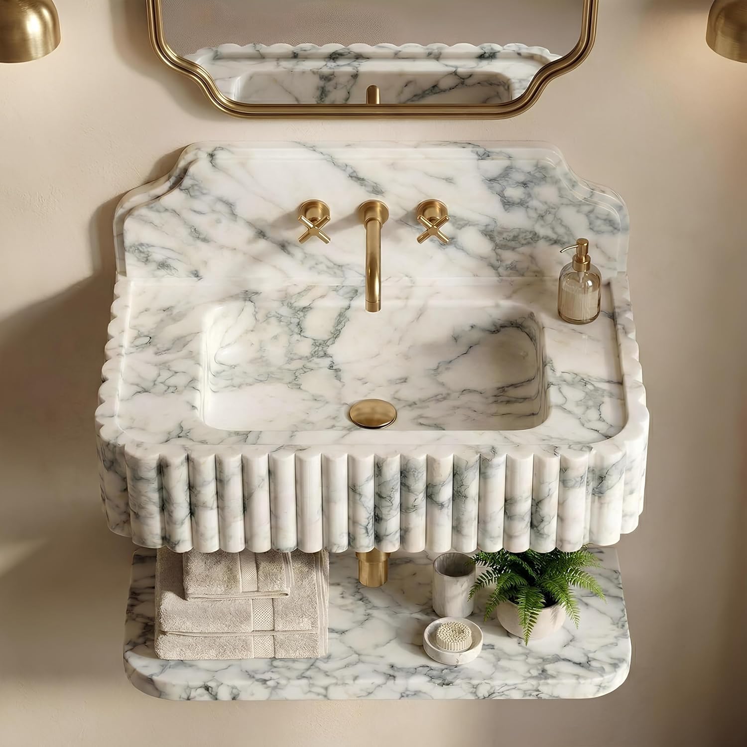 Marble sink with gold fixtures in a bathroom setting