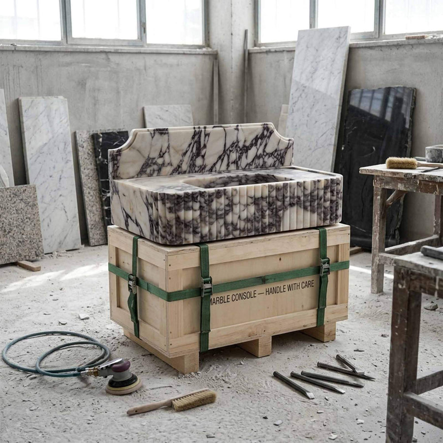 Calacatta Viola marble sink shown in workshop on shipping crate