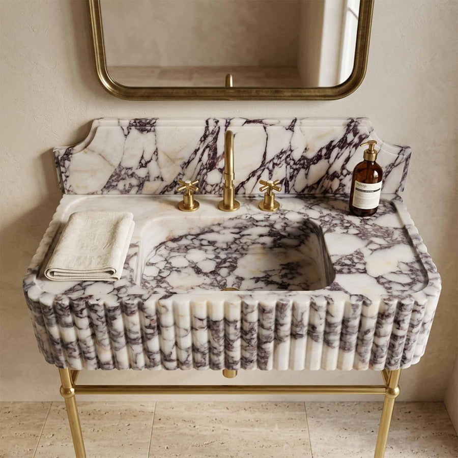 Calacatta Viola marble sink close up with widespread faucet