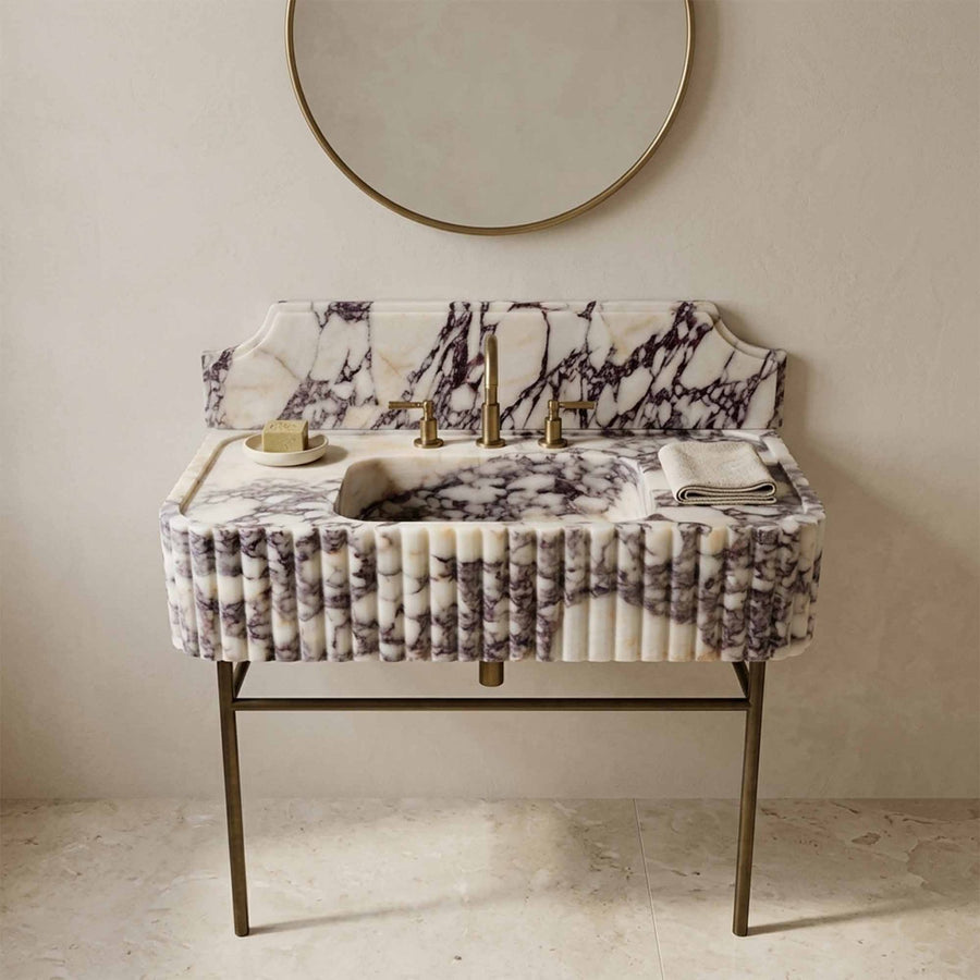 Calacatta Viola marble sink with backsplash on brass console legs