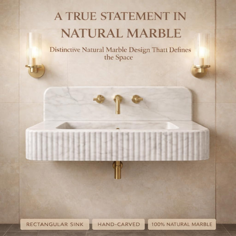 Marble sink with gold fixtures in a bathroom setting, featuring text about natural marble.
