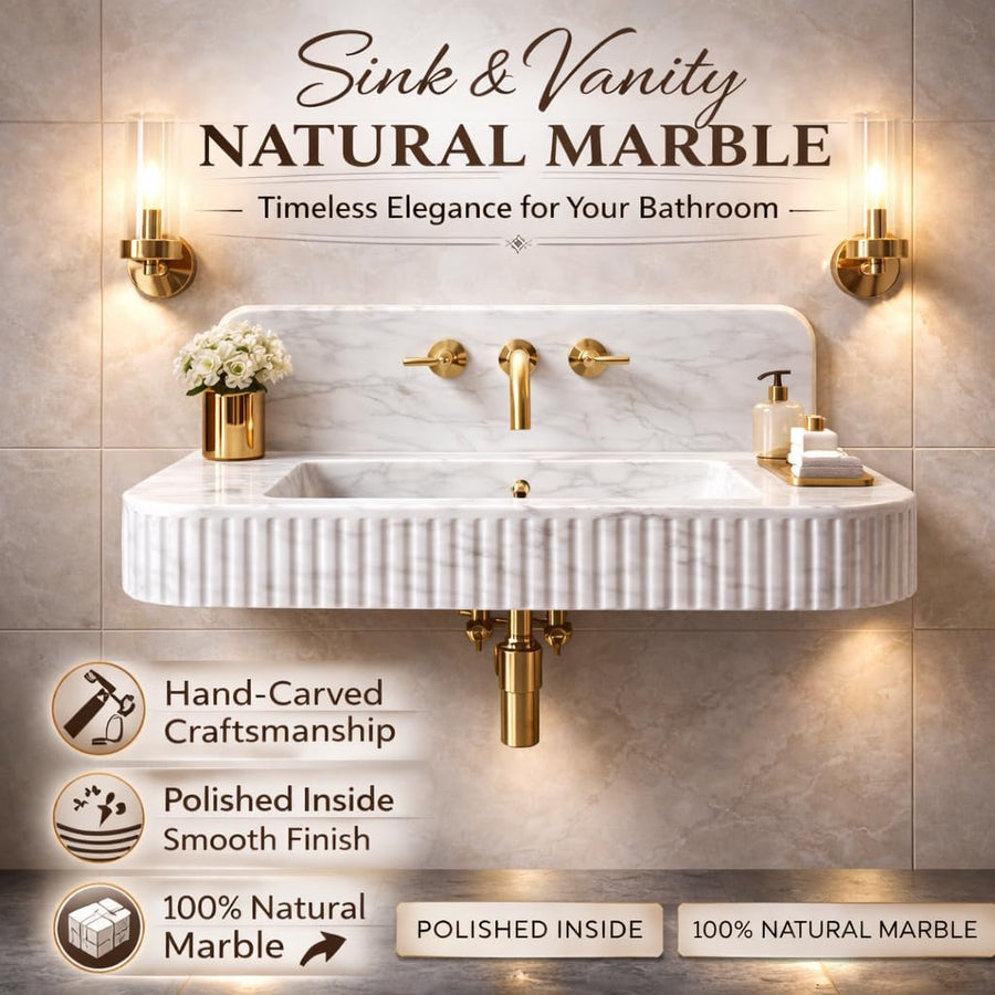 Calacatta White Marble sink with gold fixtures on a tiled wall background