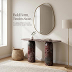 Marble console table with oval mirror and decorative items in a room setting.