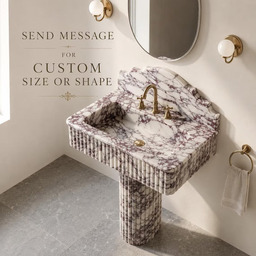 Calacatta viola marble sink with pedestal in a bathroom
