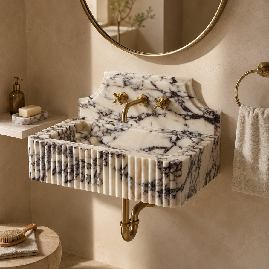 Fluted marble sink wall mounted in warm neutral bathroom