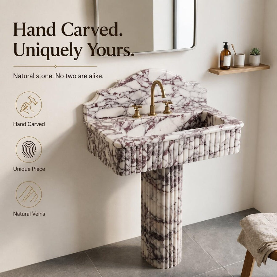Calacatta viola marble sink with pedestal in a bathroom