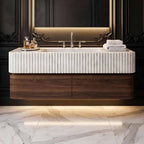 Bathroom with a modern marble sink and mirror on a wall.