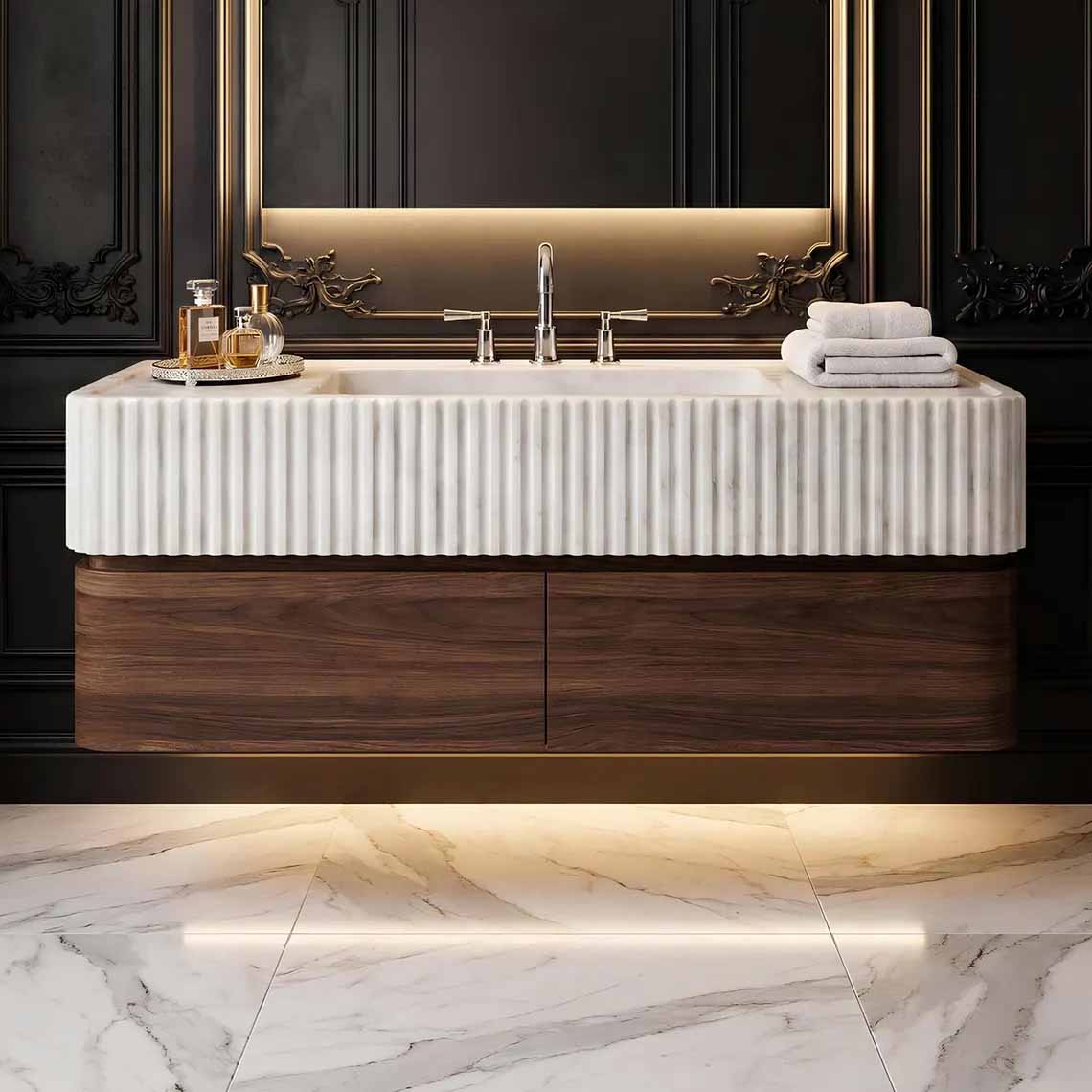 Bathroom with a modern marble sink and mirror on a wall.