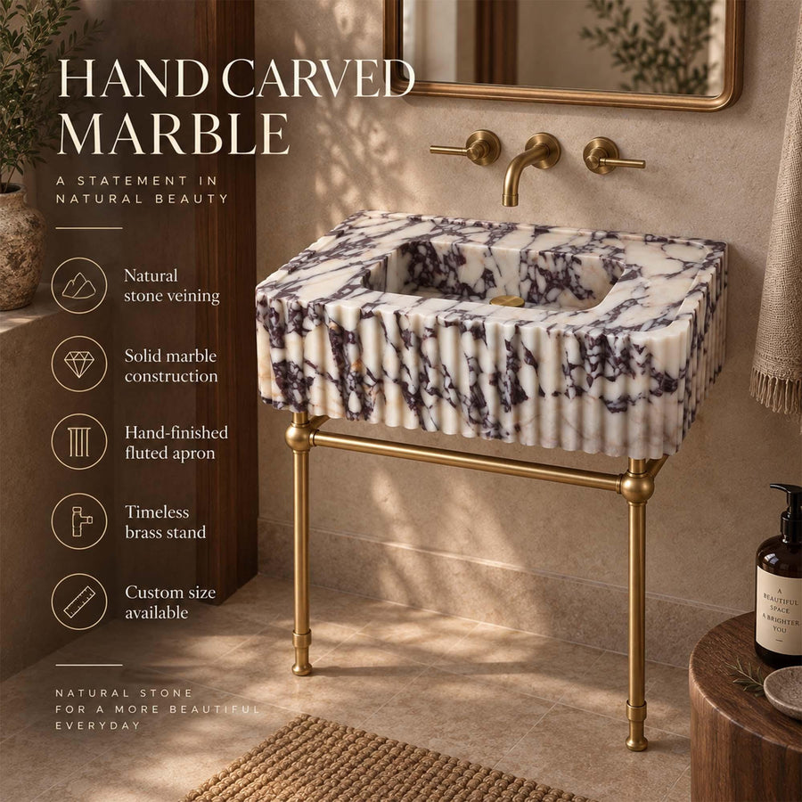 Hand-carved Calacatta Viola marble sink features: natural stone veining, solid marble construction, fluted apron