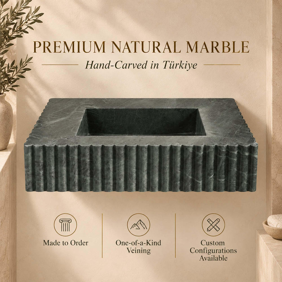 Deep rectangular basin of a hand-carved green marble scalloped console sink, top view