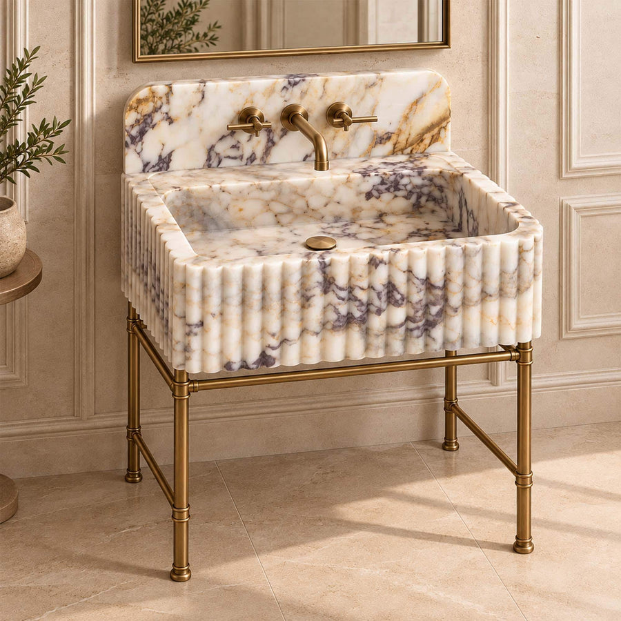 Top view of the deep integrated basin of a Calacatta Gold fluted vanity sink