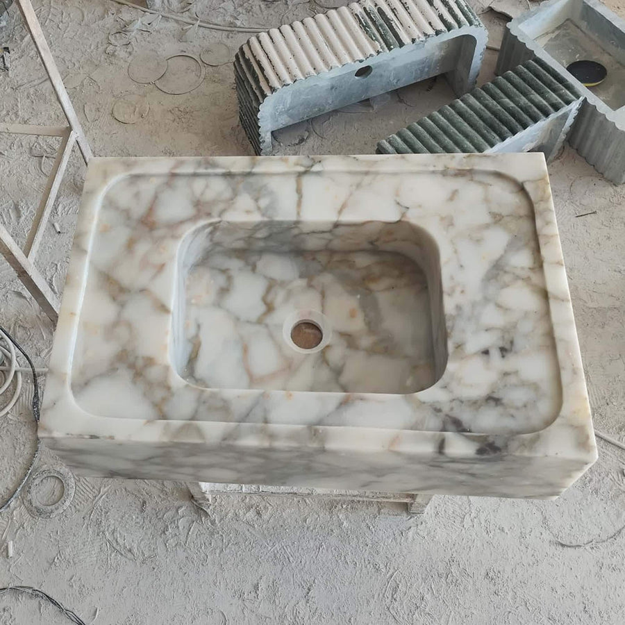 Close-up of natural veining on a Calacatta Gold smooth floating sink