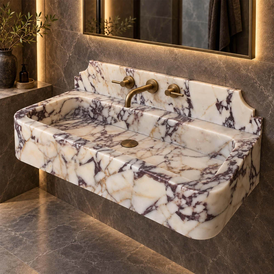 Angled view of a handcrafted Calacatta Viola bathroom sink