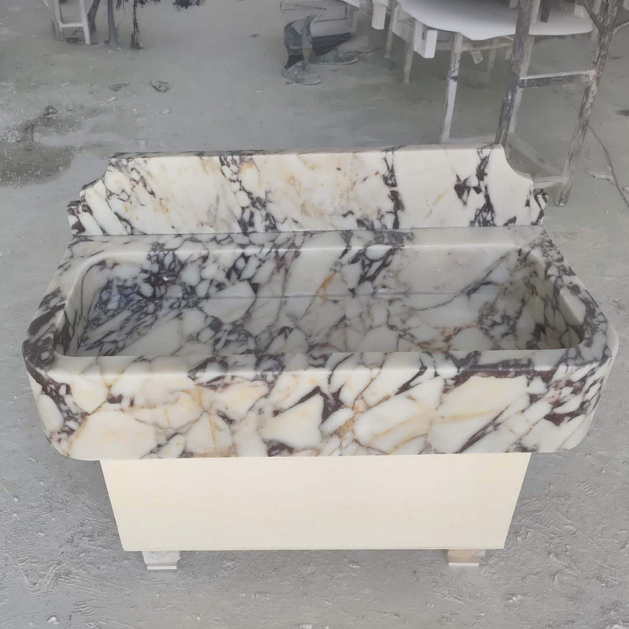 Top view of the deep integrated basin of a Calacatta Viola smooth console sink