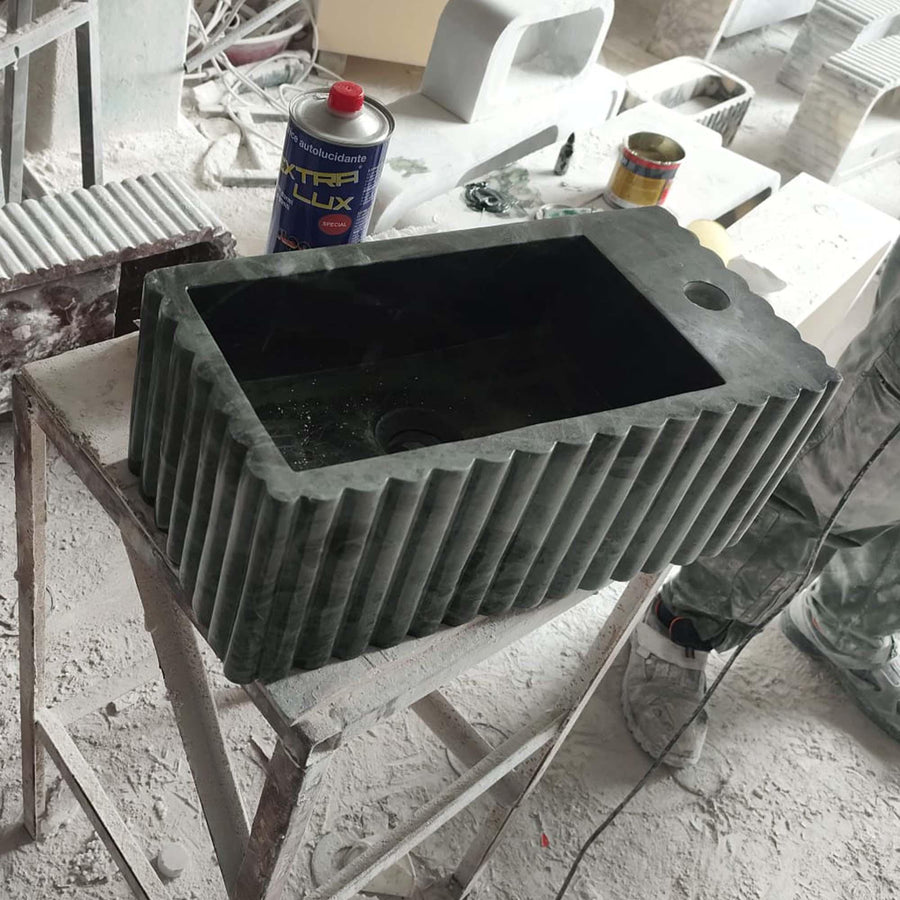 Top view of the deep integrated basin of a Green Levanto fluted vanity sink