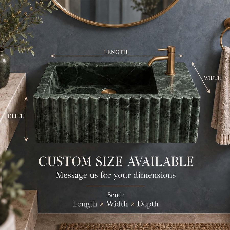 Front view of a hand-carved Green Levanto fluted vanity sink