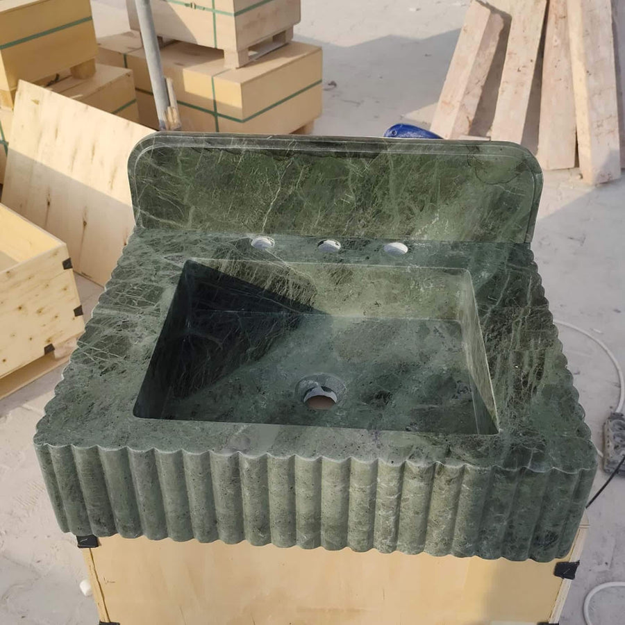 Green marble fluted vanity sink with integrated rounded backsplash, front view