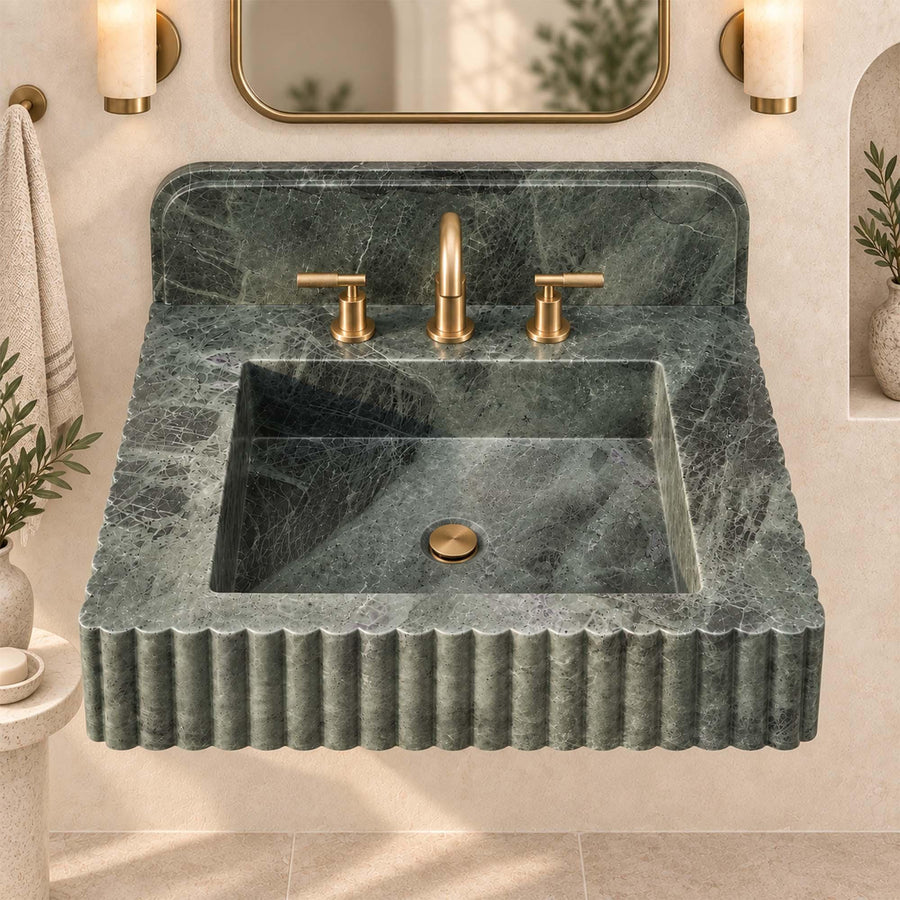Custom green marble sink with three faucet holes in a modern luxury bathroom