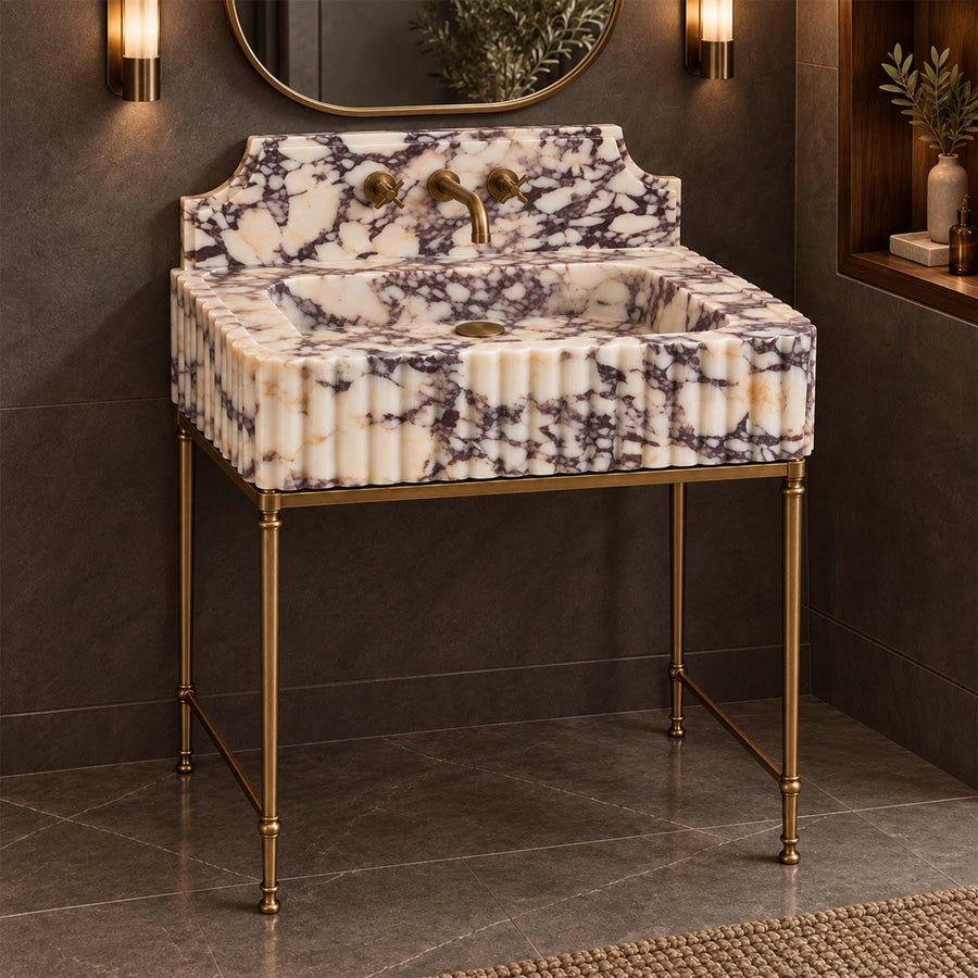 Angled view of a handcrafted Calacatta Viola bathroom sink