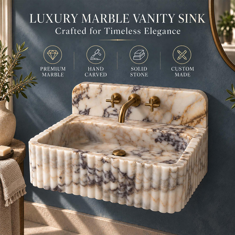 Front view of a hand-carved Calacatta Gold fluted vanity sink