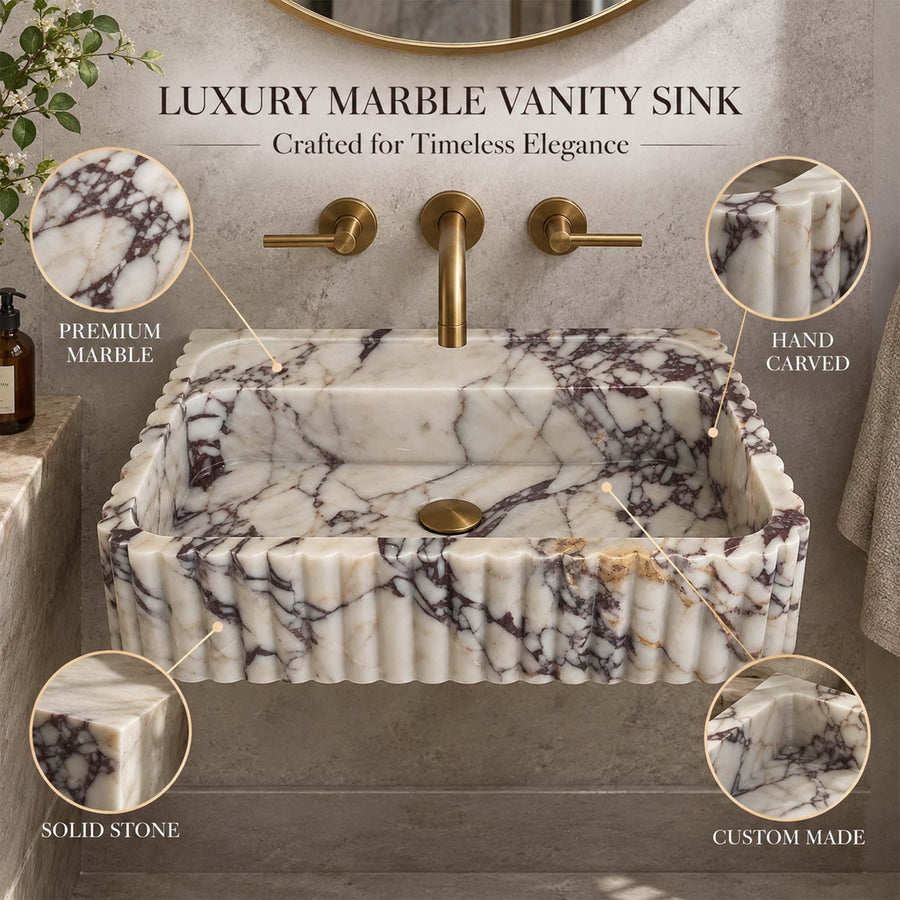 Front view of a hand-carved Calacatta Viola fluted floating sink
