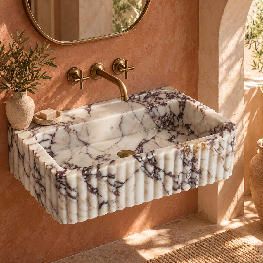 Calacatta Viola fluted floating sink detail showing hand-carved edges