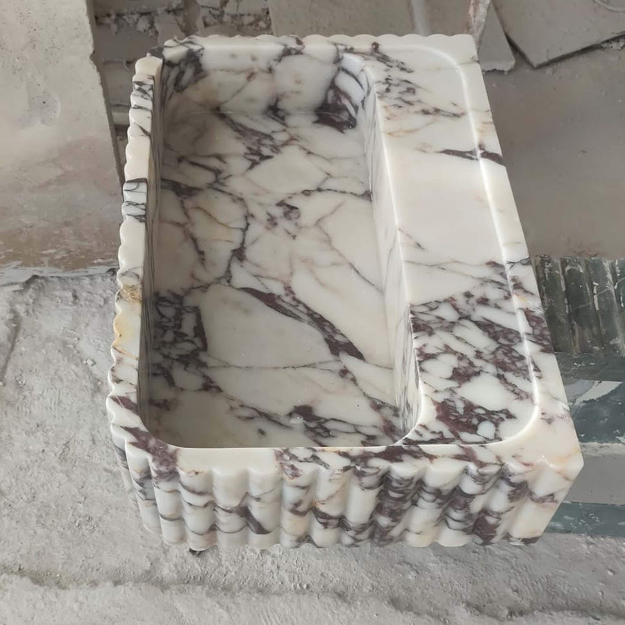 Calacatta Viola fluted floating sink with rear deck, made to order in custom sizes