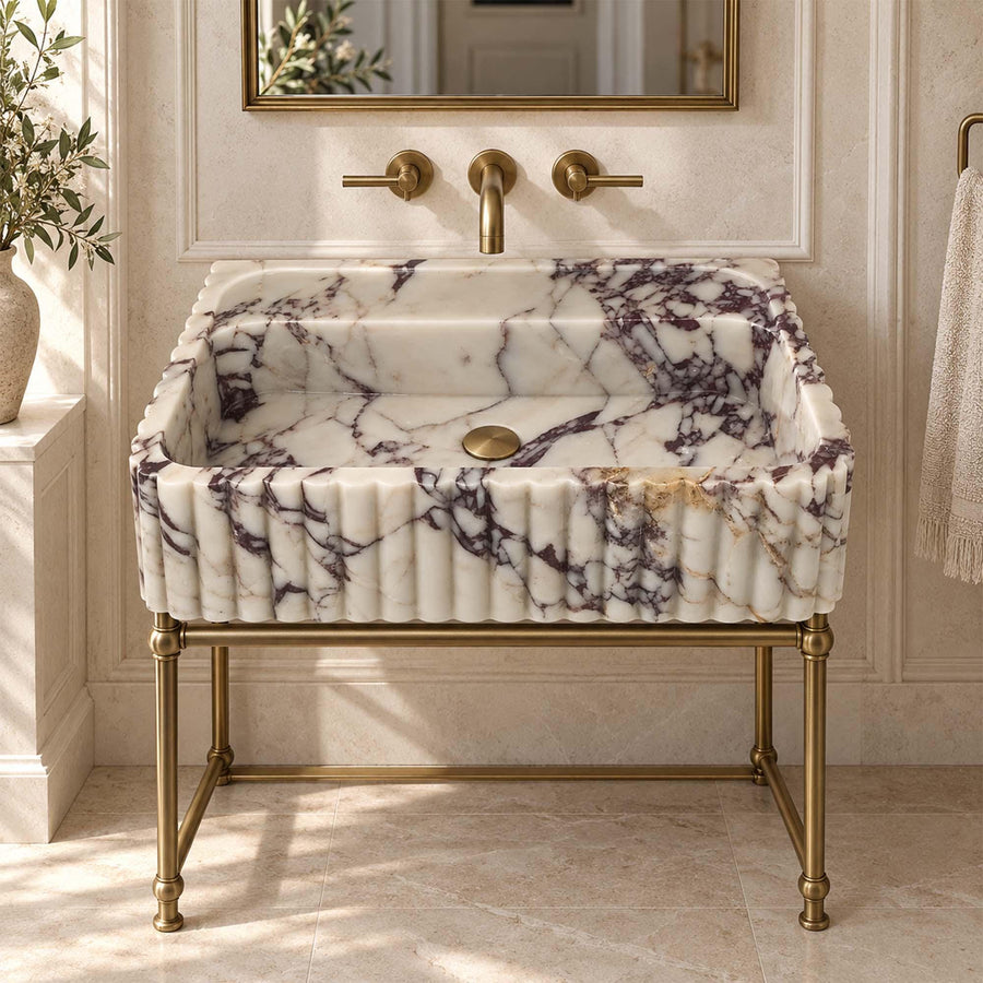Angled view of a handcrafted Calacatta Viola bathroom sink