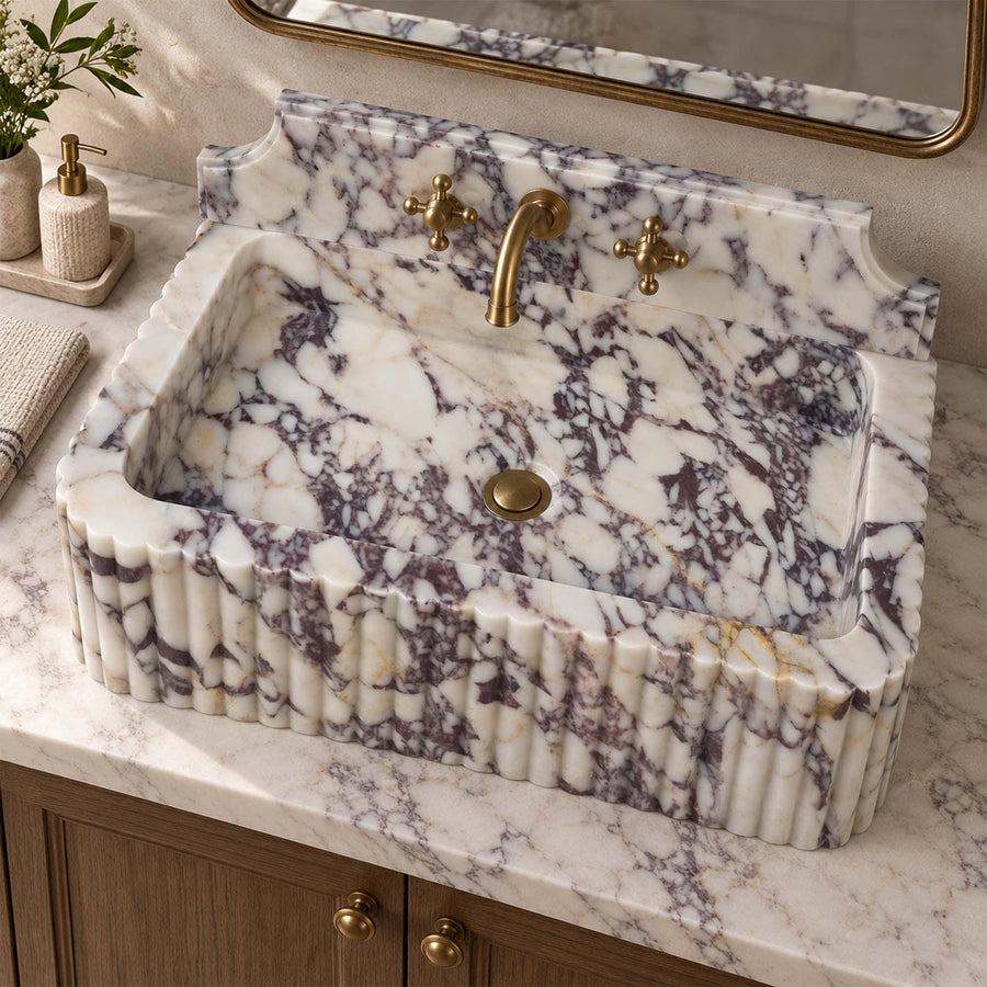 Close-up of natural veining on a Calacatta Viola fluted console sink