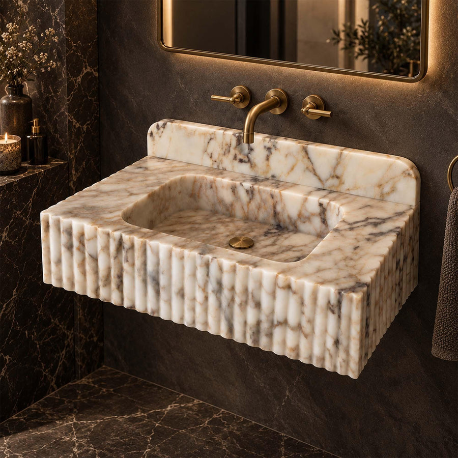 Angled view of a handcrafted Calacatta Gold bathroom sink