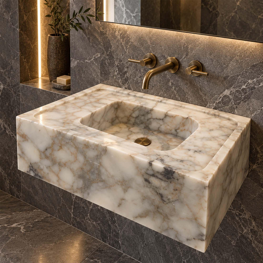 Angled view of a handcrafted Calacatta Gold bathroom sink