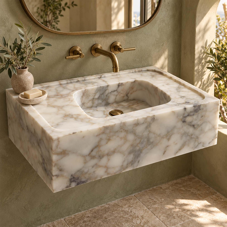 Calacatta Gold smooth floating sink detail showing hand-carved edges