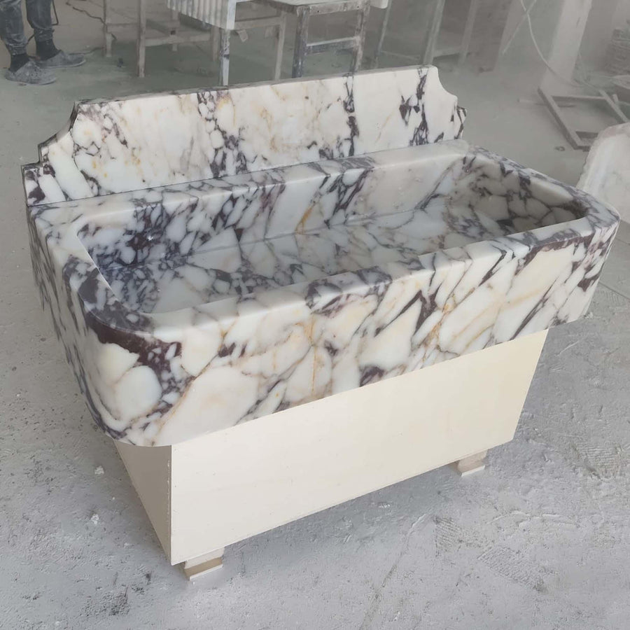 Close-up of natural veining on a Calacatta Viola smooth console sink