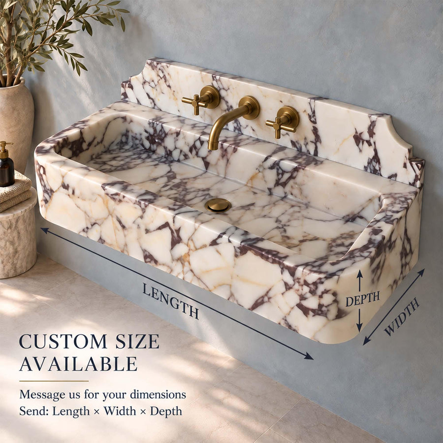 Calacatta Viola smooth console sink showing the drilled faucet holes