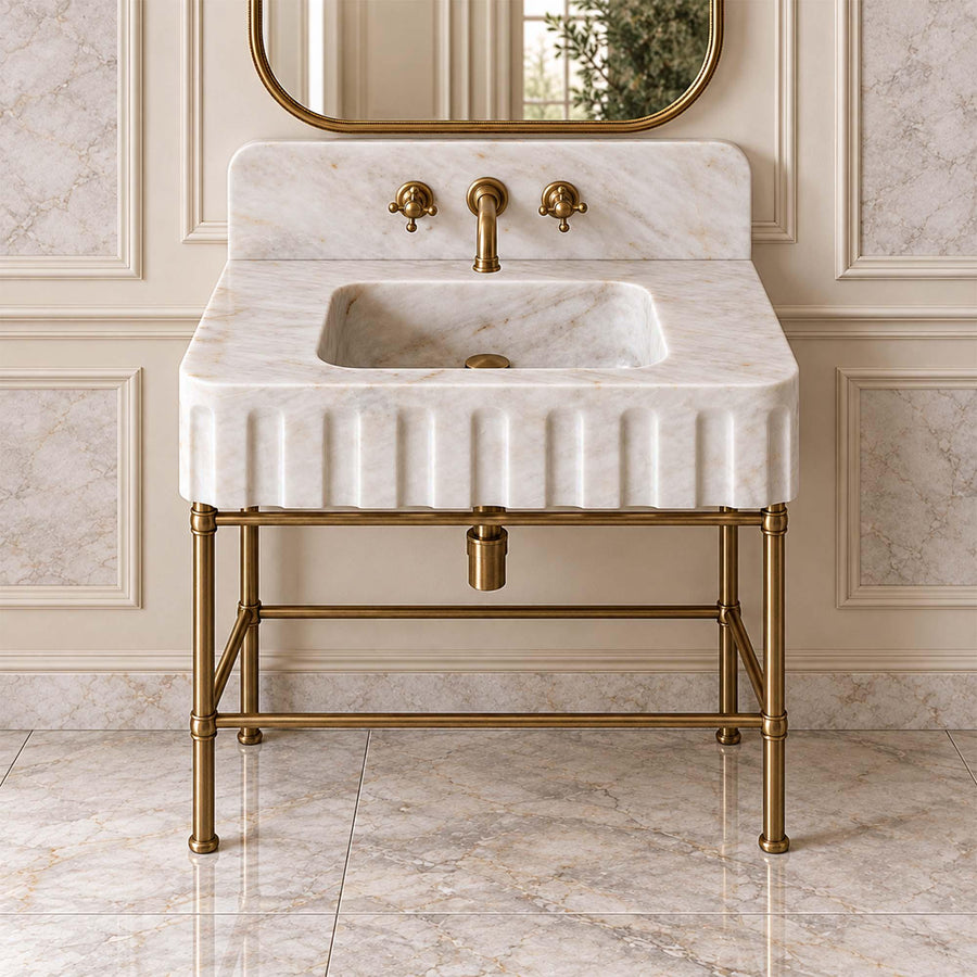 Carrara White fluted marble sink with rounded backsplash styled in a designer powder room