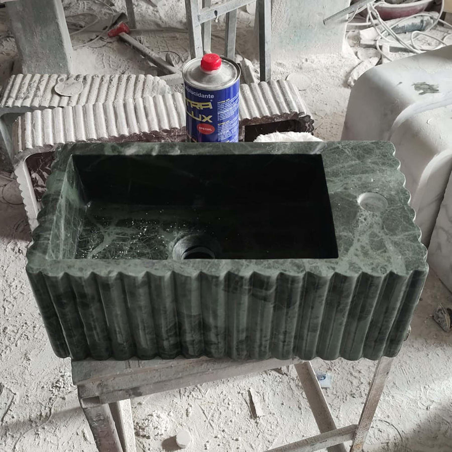 Green Levanto fluted vanity sink showing the drilled faucet holes