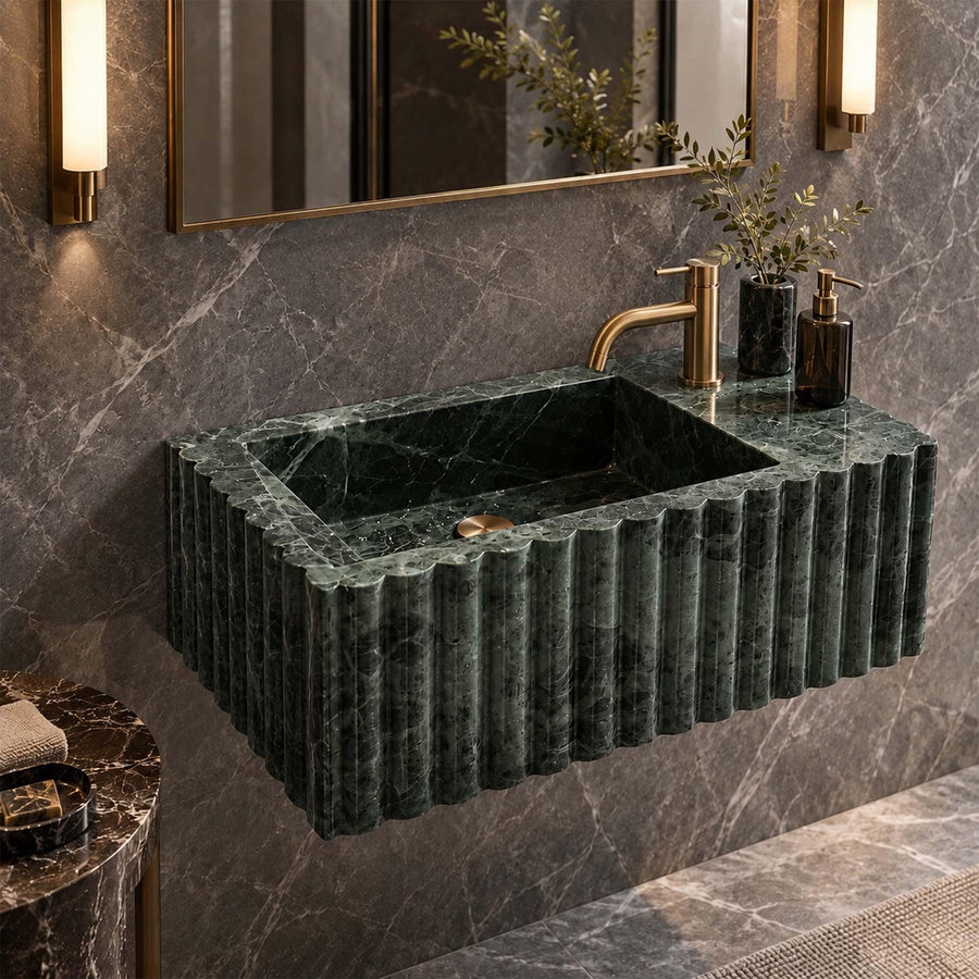 Natural stone fluted vanity sink in Green Levanto with brass fittings