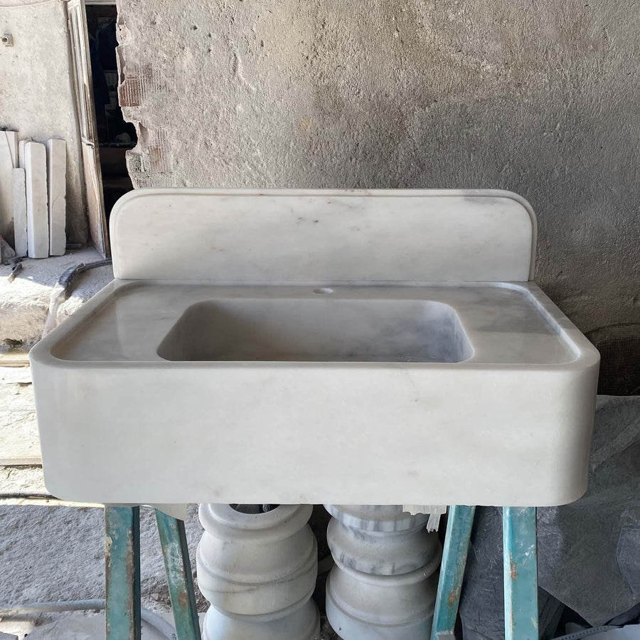 Top view of the deep integrated basin of a Carrara White console sink