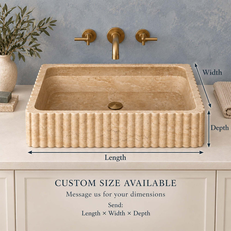 Front view of a hand-carved Beige Travertine fluted console sink